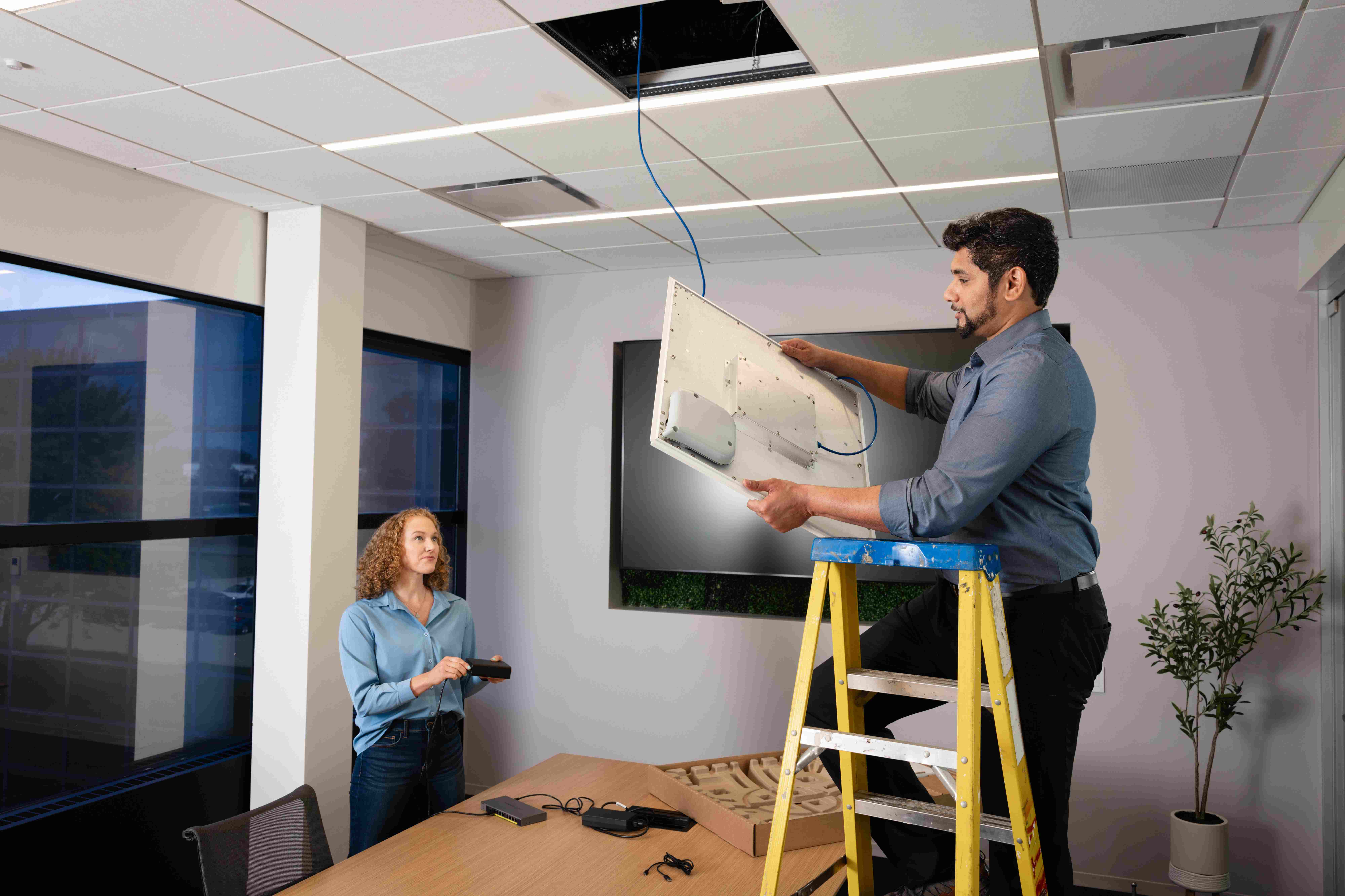 SigmaOne team installing Shure audio equipment